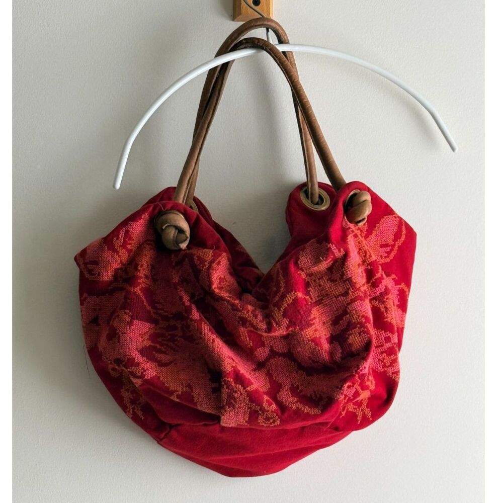 Jasper & Jeera boho red bag w/ floral cross-stitch embroidery